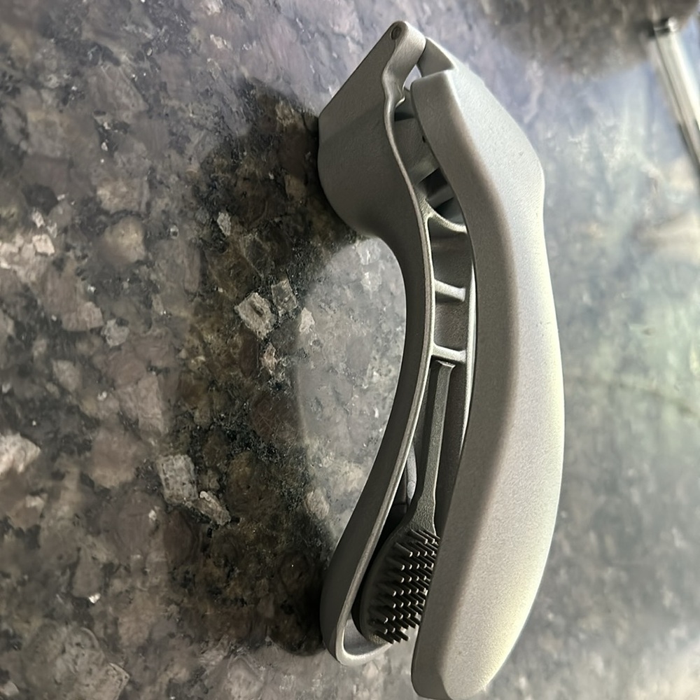 Pampered Chef garlic press with cleaning tool